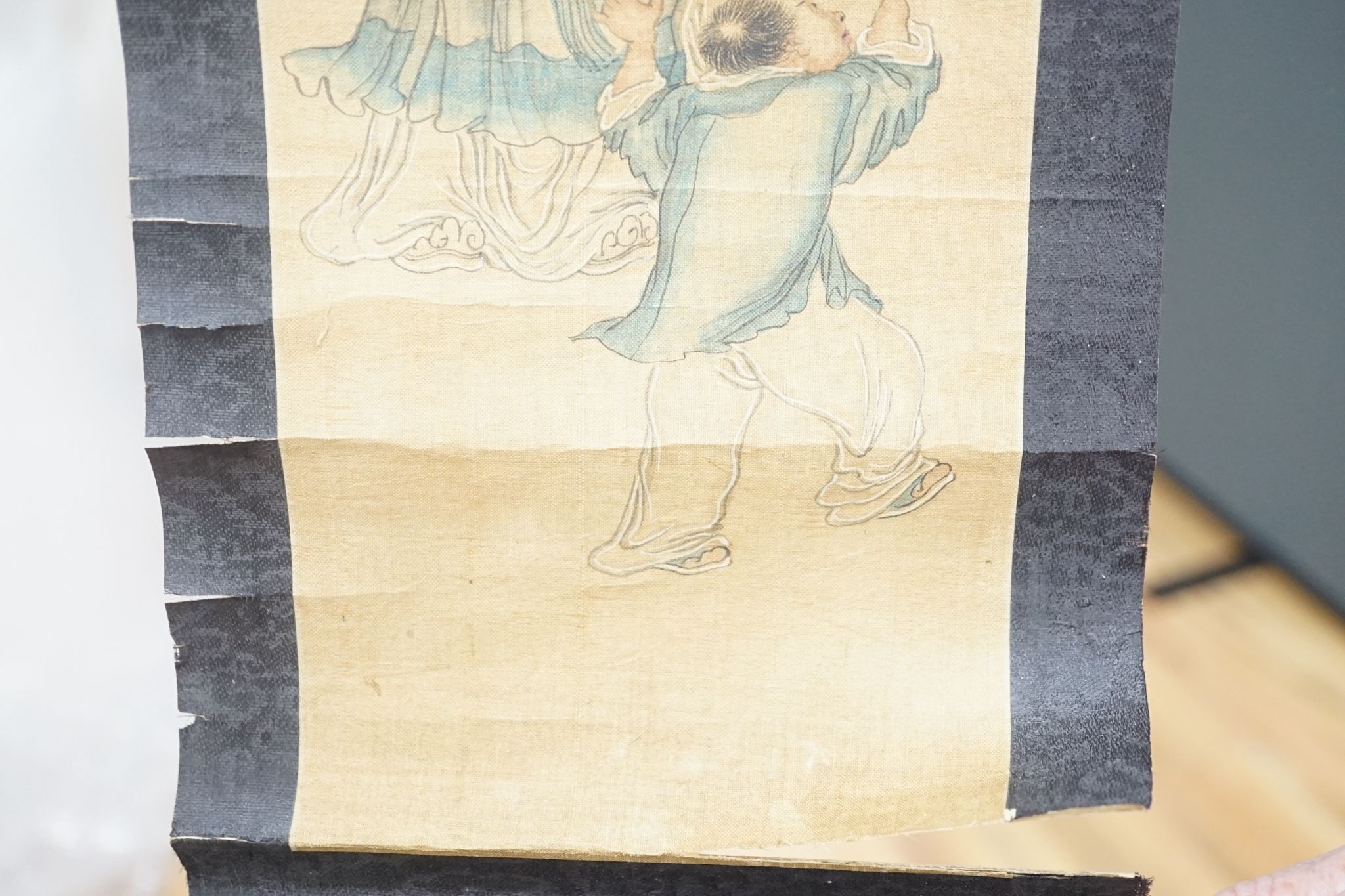 A late 19th century hand scroll and three other scroll paintings